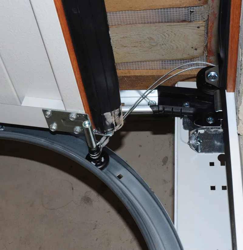 Garage door cable replacement near torsion drum hardware