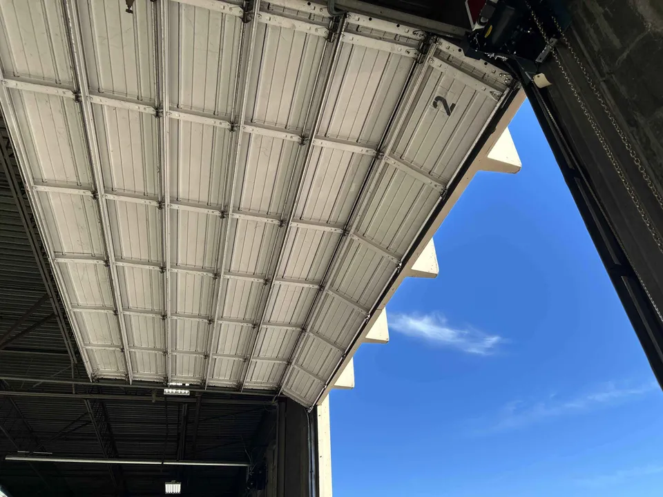 Industrial loading dock overhead door and equipment service environment
