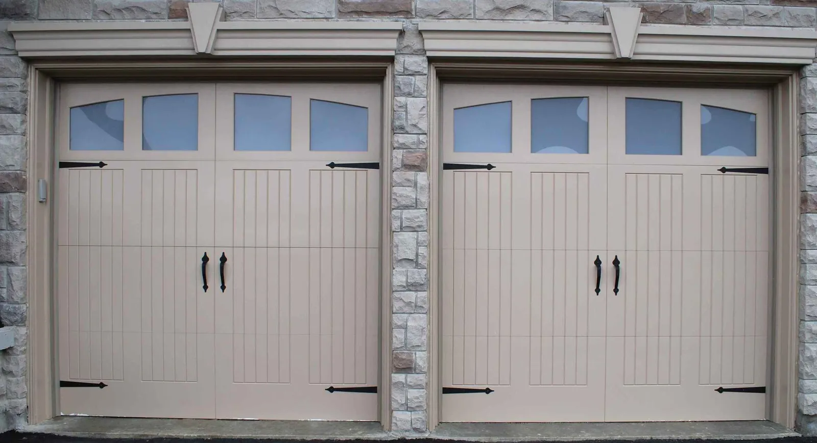 Garage door technician repairing a residential overhead door in Louisville, Kentucky