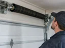 How do you know if a garage door spring is broken in Nicholasville, KY?