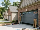 How much does it cost to install a garage door on a new Louisville home?