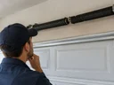 Is it safe to use a garage door with a broken spring in Shelbyville, KY?