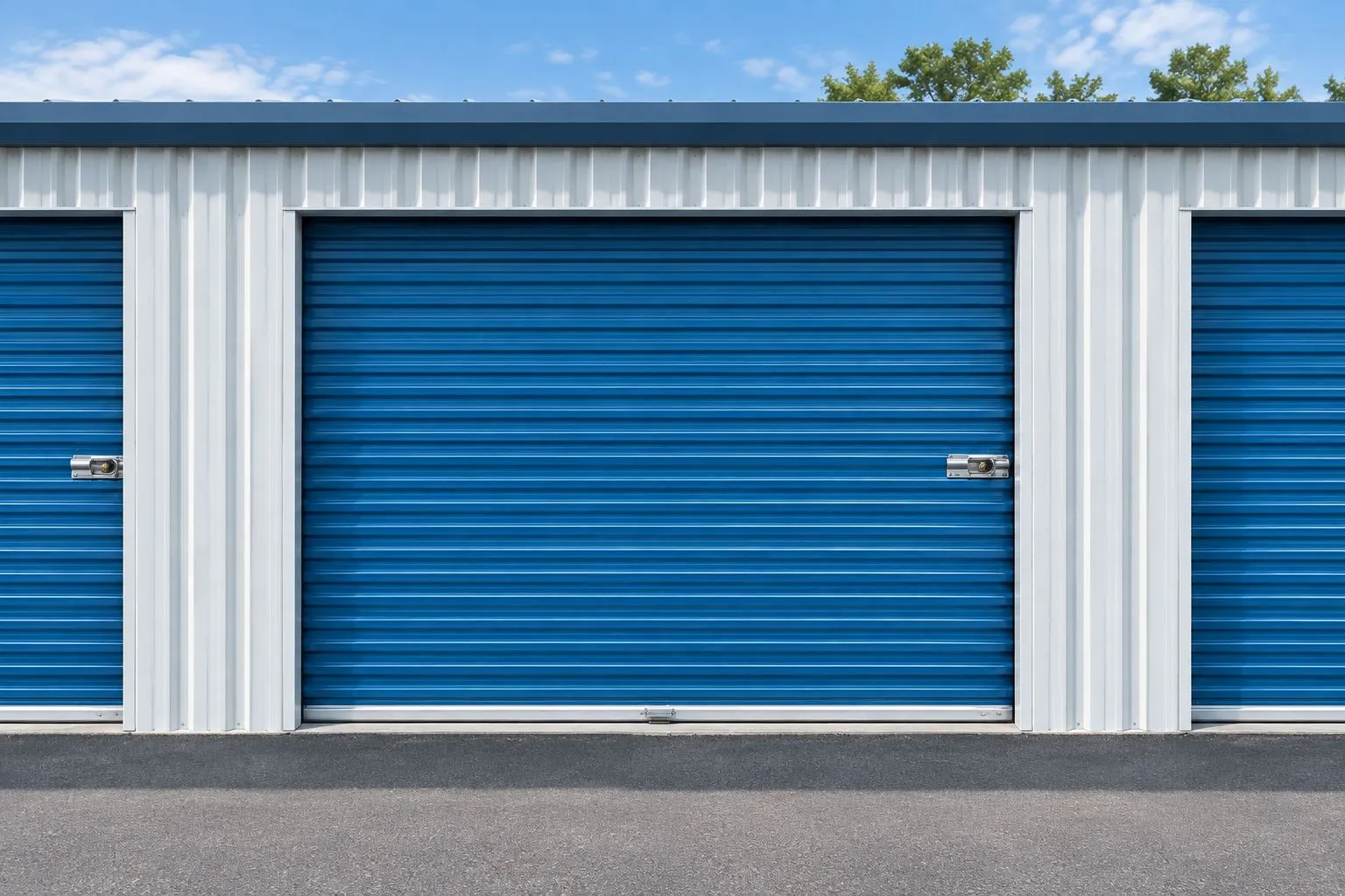 Closed ribbed metal storage-unit door with side guides and a clear paved approach