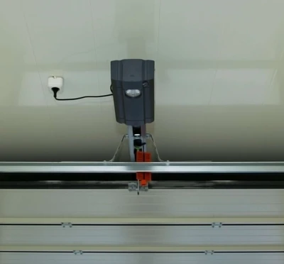 Screw-drive garage door opener with threaded steel rod drive system