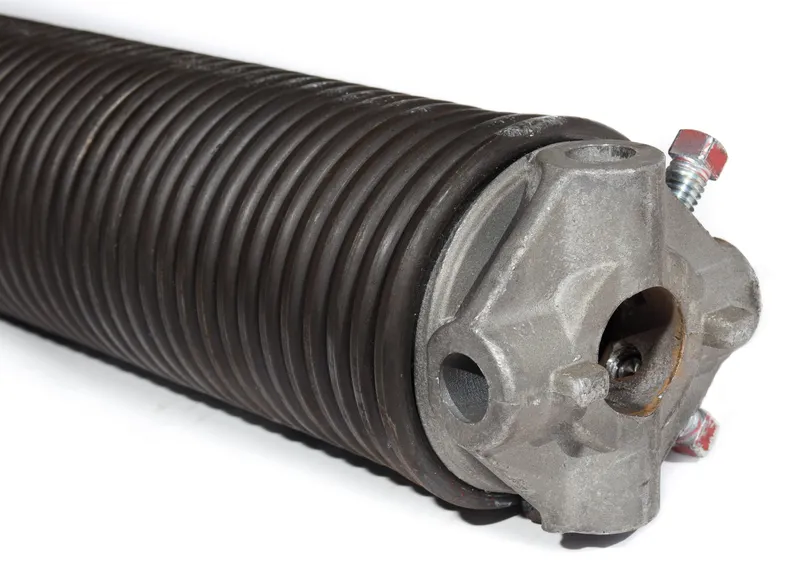 Garage door torsion spring replacement performed by a professional technician