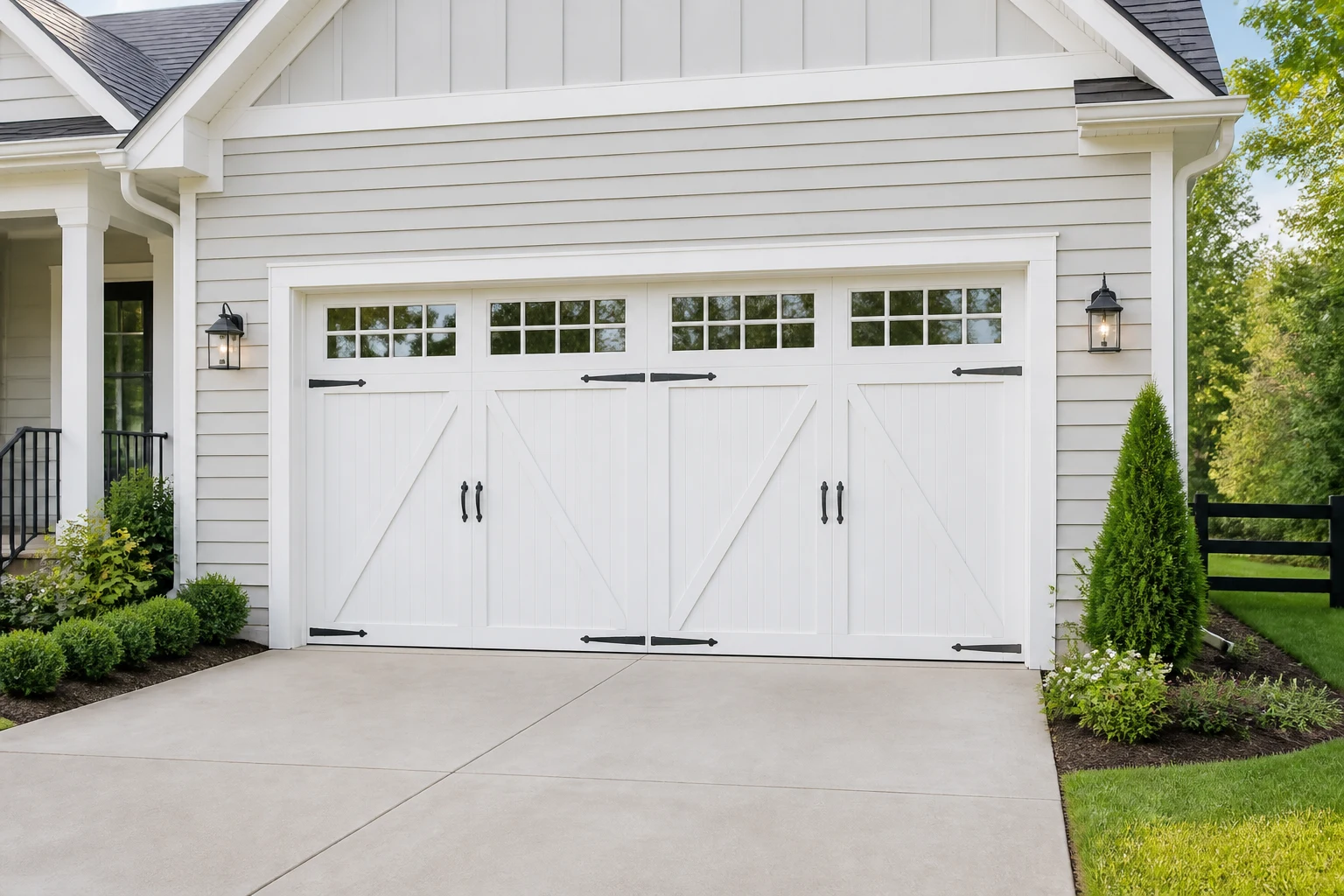 White carriage house garage doors on a Kentucky home in morning light
